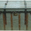 image of an emigrant's trunk with leather straps and brass fittings